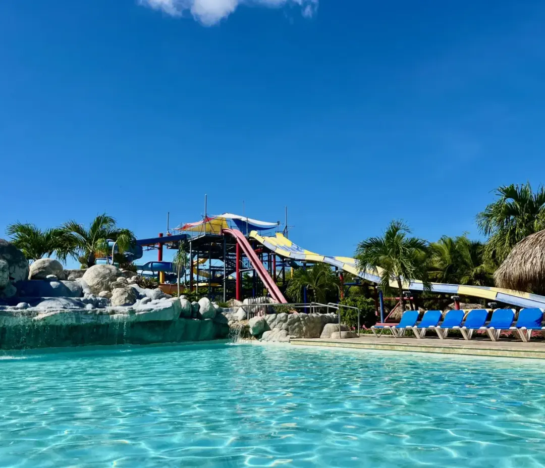 The main pool at Grand Sirenis Punta Cana, with the Aquagames slides behind it.
