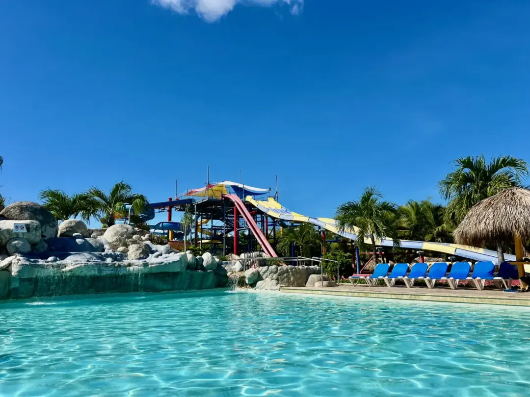 The main pool at Grand Sirenis Punta Cana, with the Aquagames slides behind it.