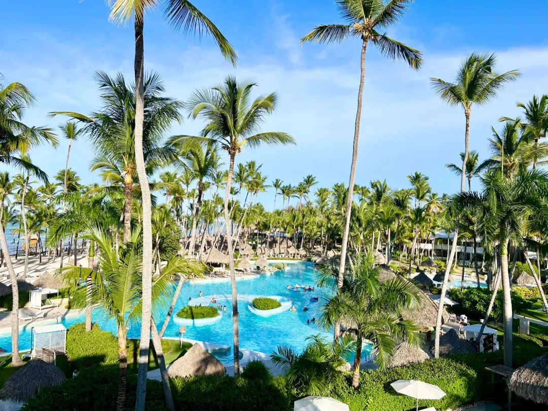The main pool at Meliá Punta Cana Beach, empty at eight in the morning.