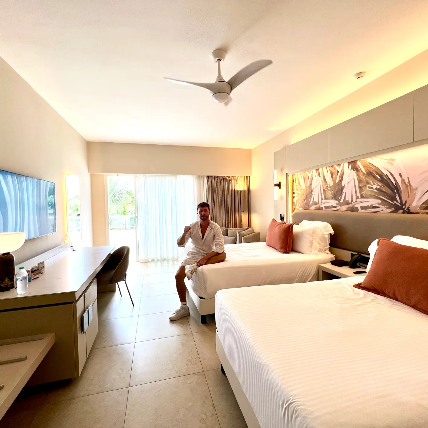 The Allure Junior Suite at Breathless, bed and terrace door.