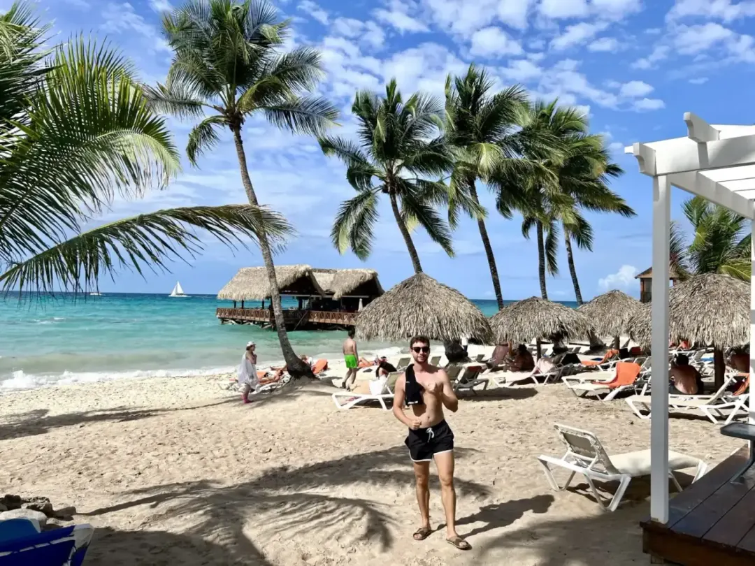 The beach at Sunscape Dominicus La Romana, loungers under the palms.